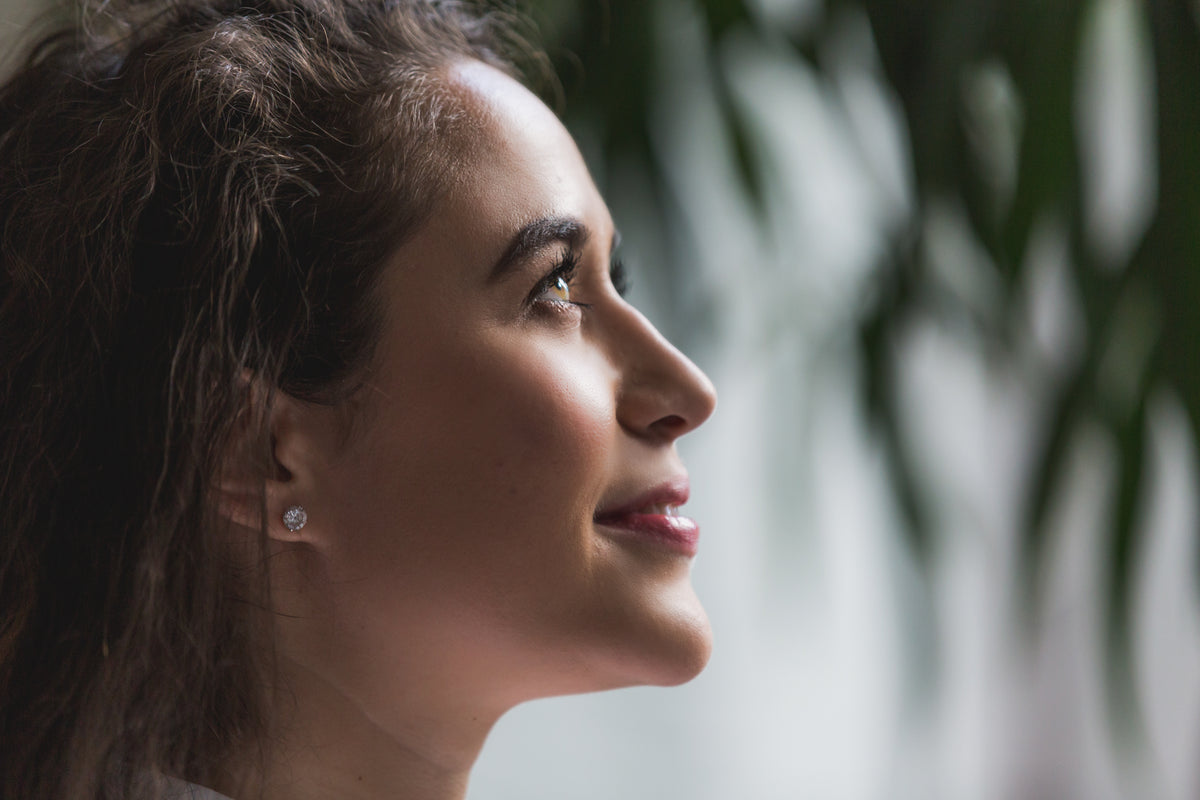 Side profile showing a defined jawline, chin, and neck — result of non-surgical chin and neck lifting